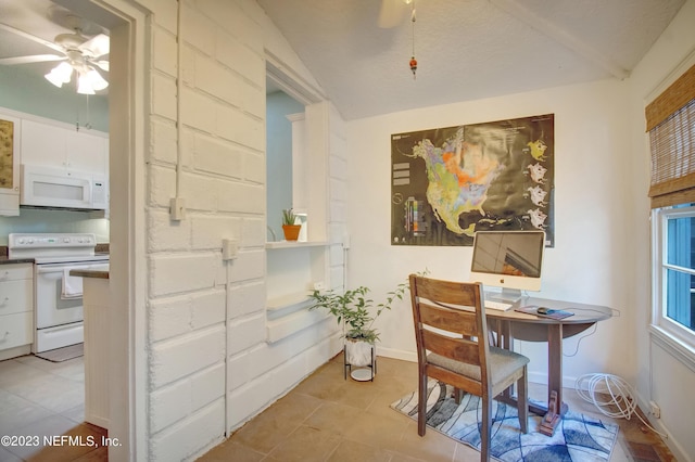 dining area with light tile patterned floors and ceiling fan