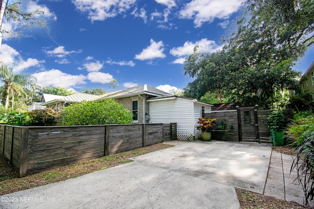 view of side of property featuring a patio area