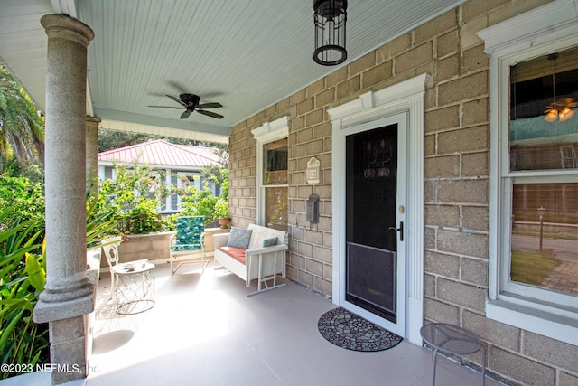 doorway to property featuring ceiling fan and covered porch