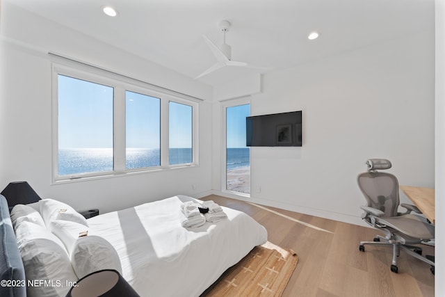 bedroom featuring light hardwood / wood-style flooring and ceiling fan