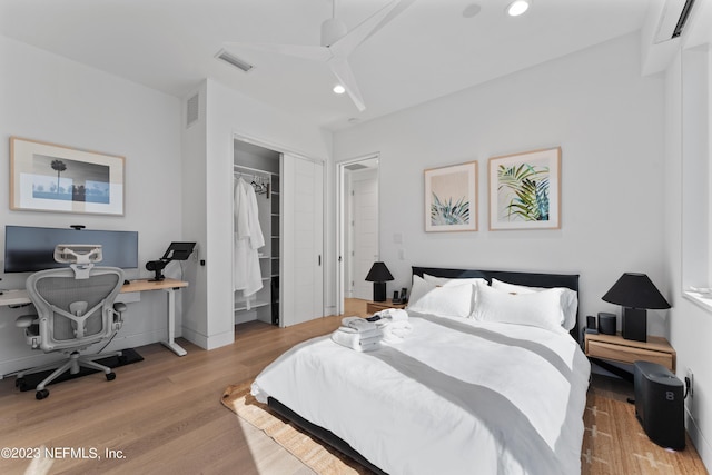 bedroom featuring light wood-type flooring and a closet