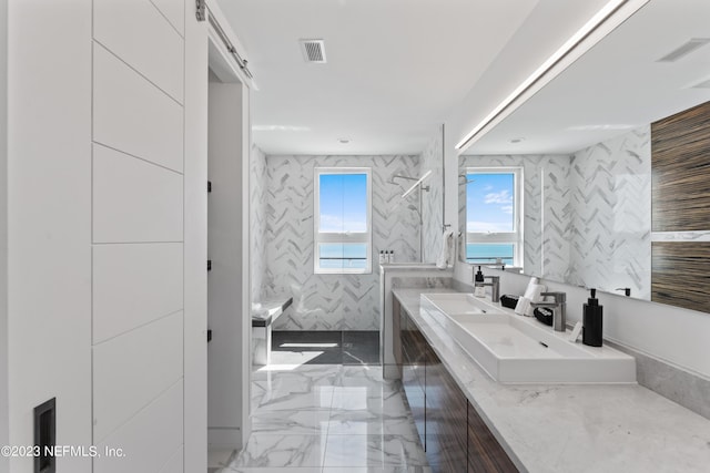 bathroom featuring vanity, tile walls, and walk in shower