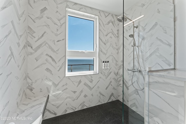 bathroom featuring tiled shower