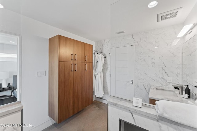 bathroom featuring vanity and walk in shower