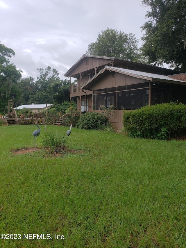 view of home's exterior featuring a yard