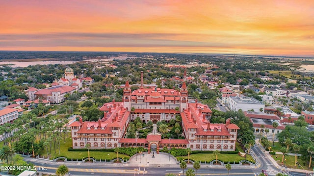 aerial view at dusk with a water view