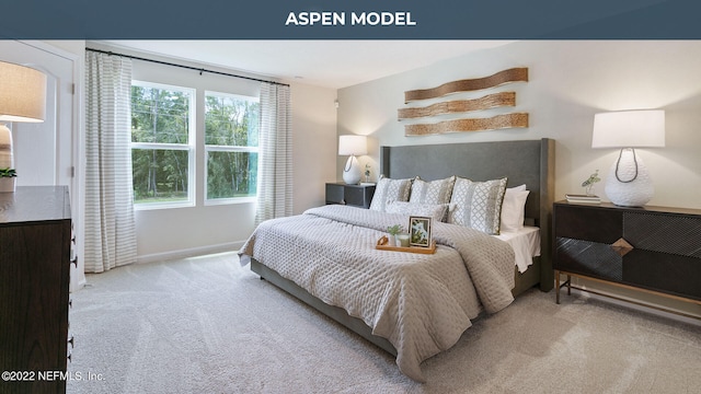 bedroom featuring light carpet and baseboards