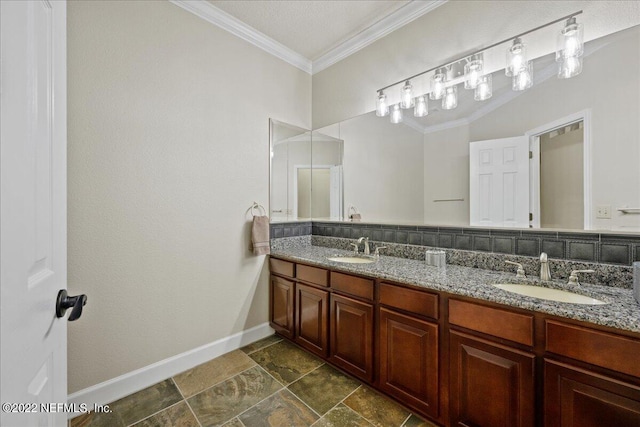 bathroom with vanity and ornamental molding