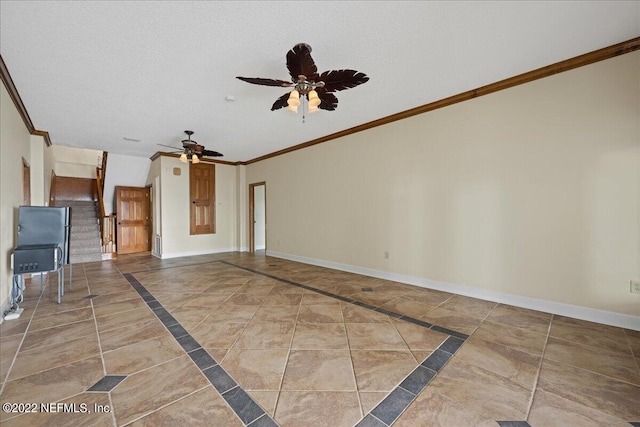 unfurnished living room featuring ceiling fan, a textured ceiling, and ornamental molding