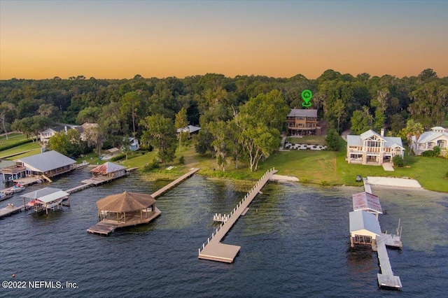 aerial view at dusk with a water view