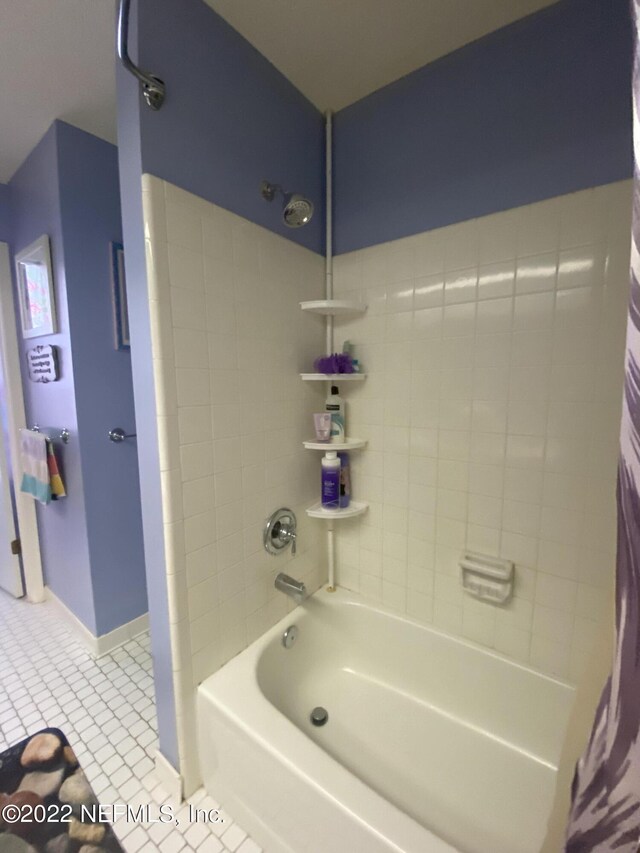 bathroom featuring shower / tub combo and tile patterned floors