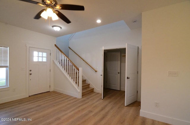 foyer featuring ceiling fan and light wood-type flooring