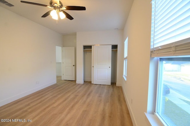 unfurnished bedroom featuring light hardwood / wood-style floors and ceiling fan