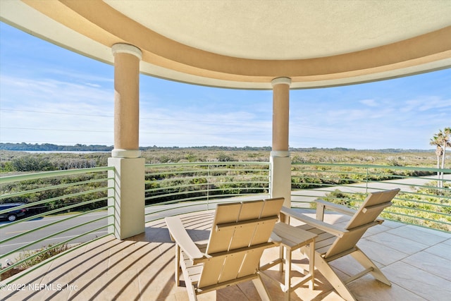 view of patio featuring a balcony