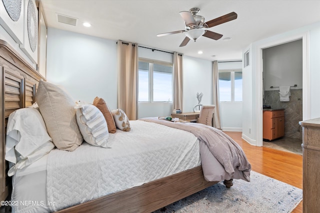 bedroom featuring ceiling fan and light hardwood / wood-style floors