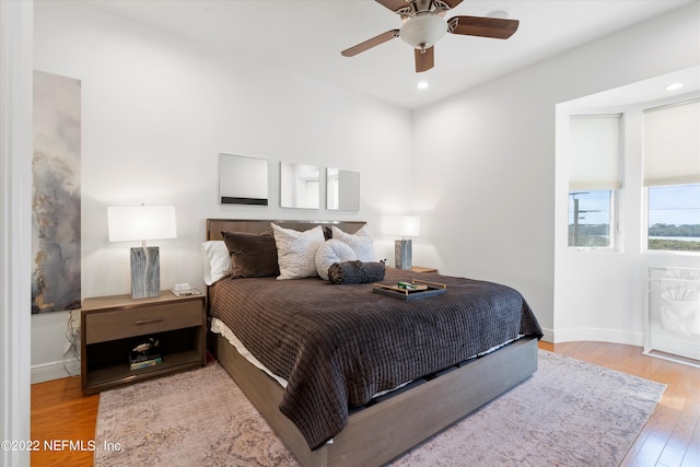 bedroom featuring light hardwood / wood-style flooring and ceiling fan