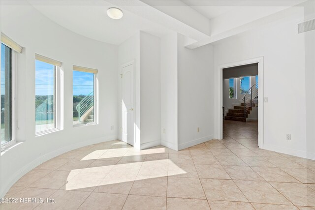 spare room with light tile patterned floors