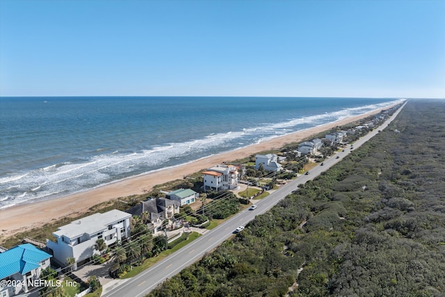 bird's eye view with a water view and a view of the beach