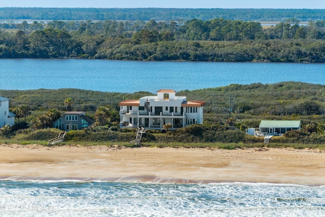 bird's eye view featuring a water view and a view of the beach