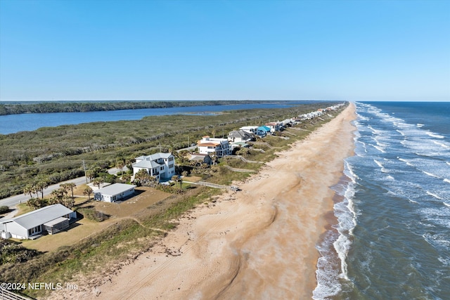 bird's eye view with a beach view and a water view