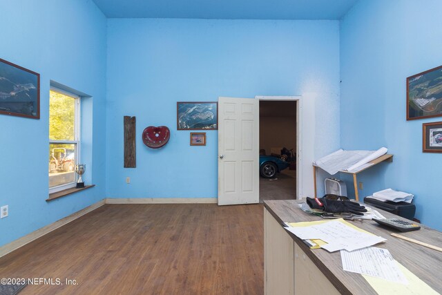 office with dark wood-type flooring