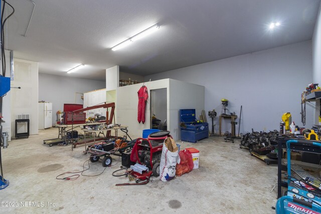 garage with white fridge