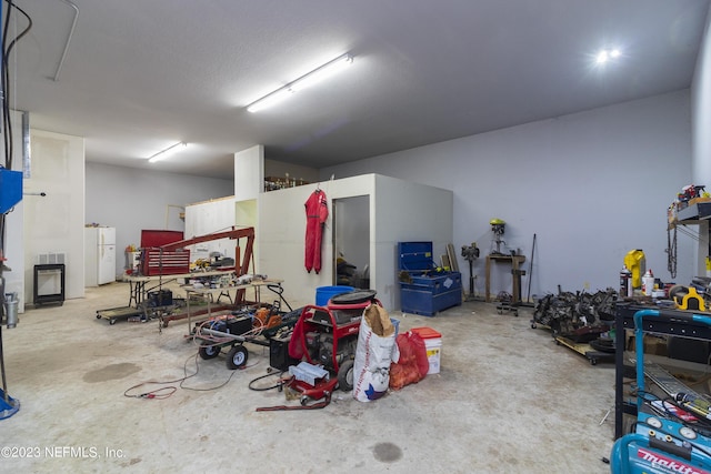 garage featuring white refrigerator