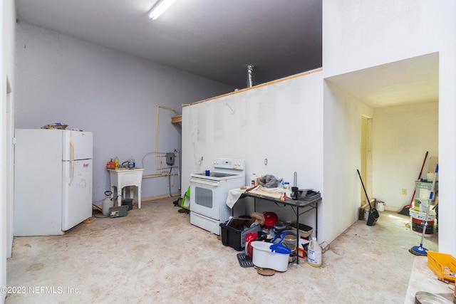 interior space featuring sink and white fridge