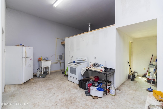 kitchen with white appliances and sink