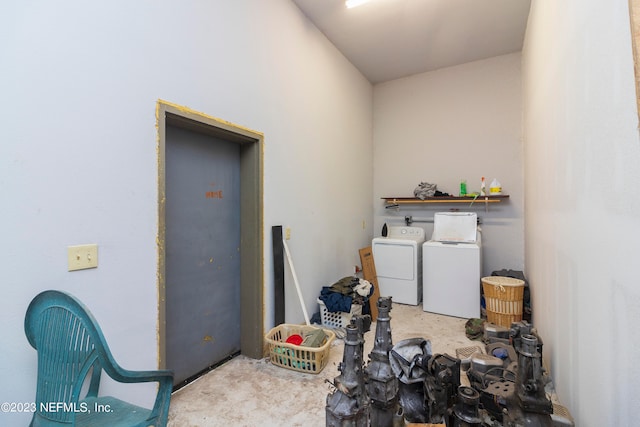 clothes washing area featuring separate washer and dryer