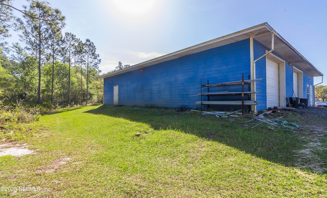 back of house featuring a lawn