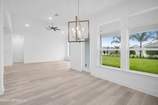 unfurnished dining area with light wood-style floors, plenty of natural light, visible vents, and recessed lighting