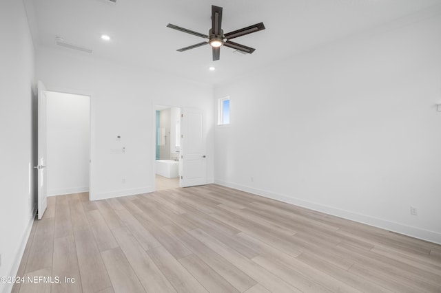 unfurnished bedroom with baseboards, a ceiling fan, ensuite bathroom, light wood-style floors, and recessed lighting