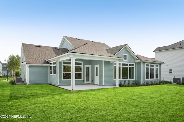 back of house featuring a patio area, a yard, and cooling unit