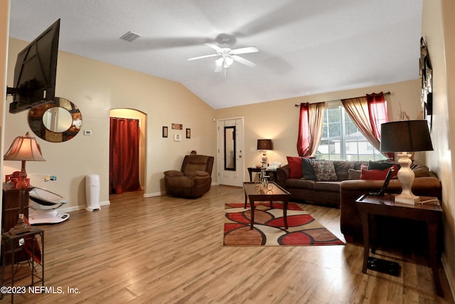 living room with vaulted ceiling, ceiling fan, and light hardwood / wood-style flooring