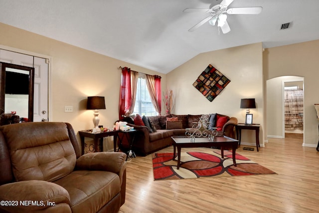 living room with light wood-type flooring, lofted ceiling, and ceiling fan