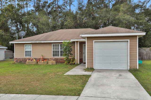 ranch-style house featuring a garage and a front lawn