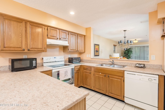 kitchen featuring an inviting chandelier, white appliances, sink, hanging light fixtures, and light tile patterned floors