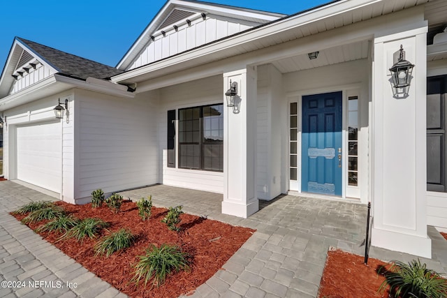 entrance to property featuring a garage