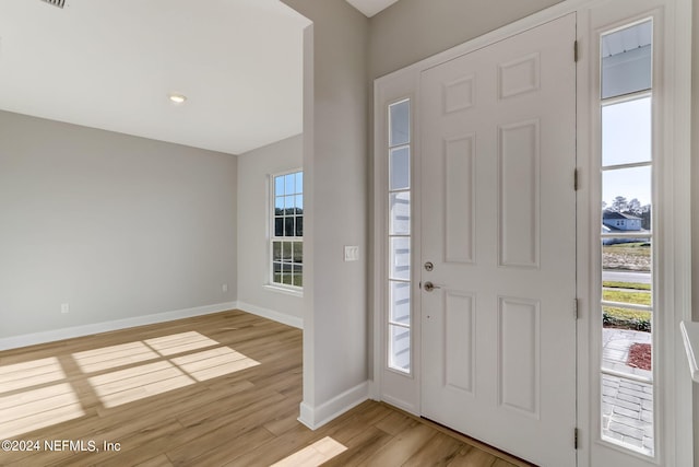 entryway with light hardwood / wood-style flooring