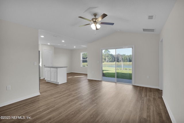 unfurnished living room with lofted ceiling, ceiling fan, and hardwood / wood-style floors