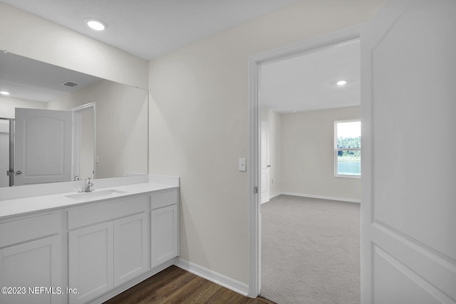 bathroom featuring vanity and hardwood / wood-style flooring