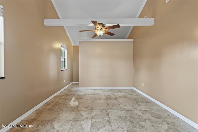 empty room featuring vaulted ceiling with beams, ceiling fan, and crown molding