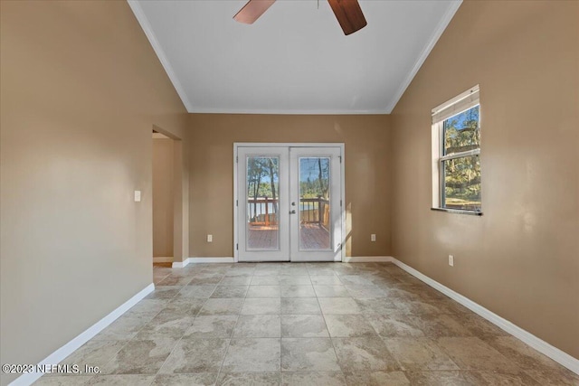 spare room featuring ornamental molding, vaulted ceiling, ceiling fan, and french doors