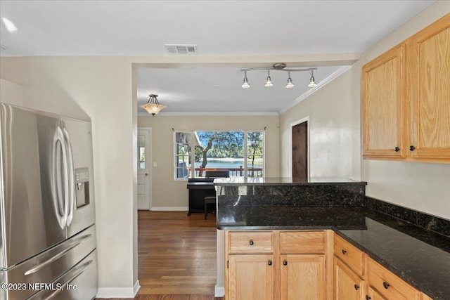 kitchen featuring dark hardwood / wood-style flooring, light brown cabinets, crown molding, dark stone counters, and stainless steel fridge with ice dispenser