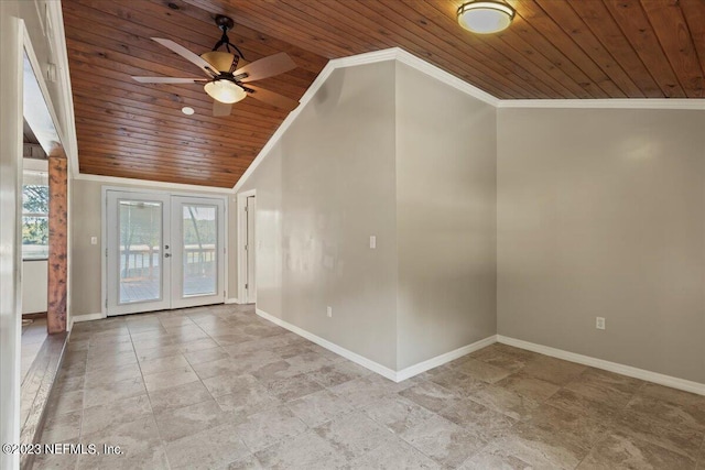 empty room with wooden ceiling, lofted ceiling, ceiling fan, and french doors