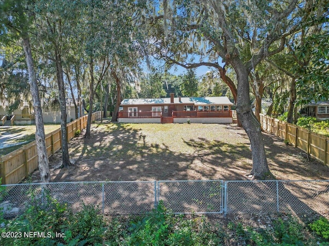 182 Cargo Way, Keystone Heights, FL 32656 - fenced backyard featuring a deck