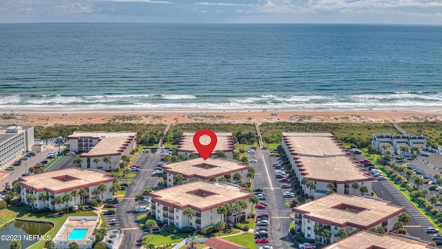 aerial view featuring a water view and a view of the beach