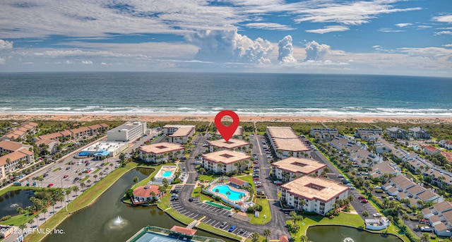 aerial view featuring a water view and a view of the beach