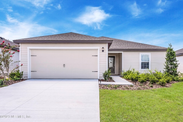 single story home with a front yard and a garage